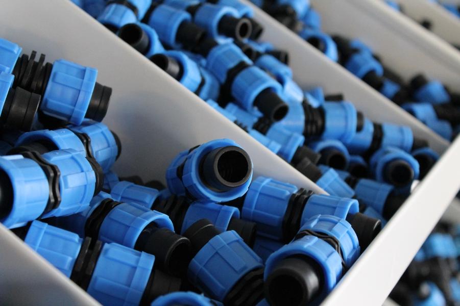 Detailed view of blue Greener Drip connectors illustrating superior build.